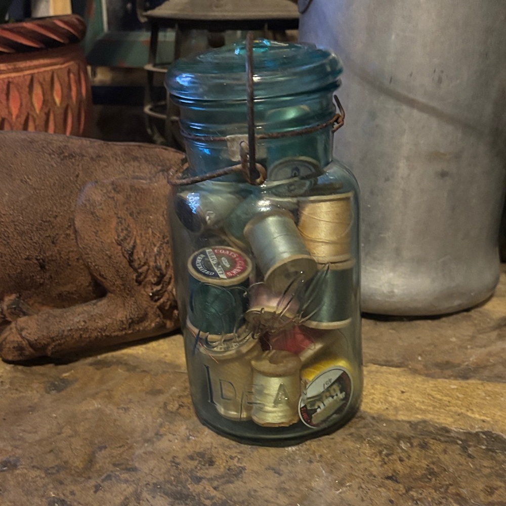 Vintage Glass Jar with Assorted Thread Spools